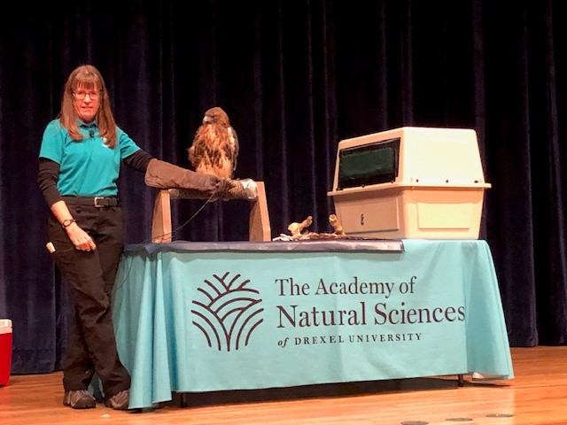 Science academy worker with a eagle