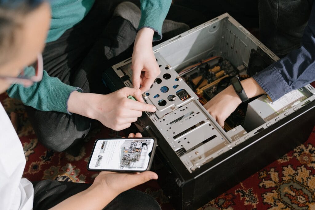 people fixing the computer