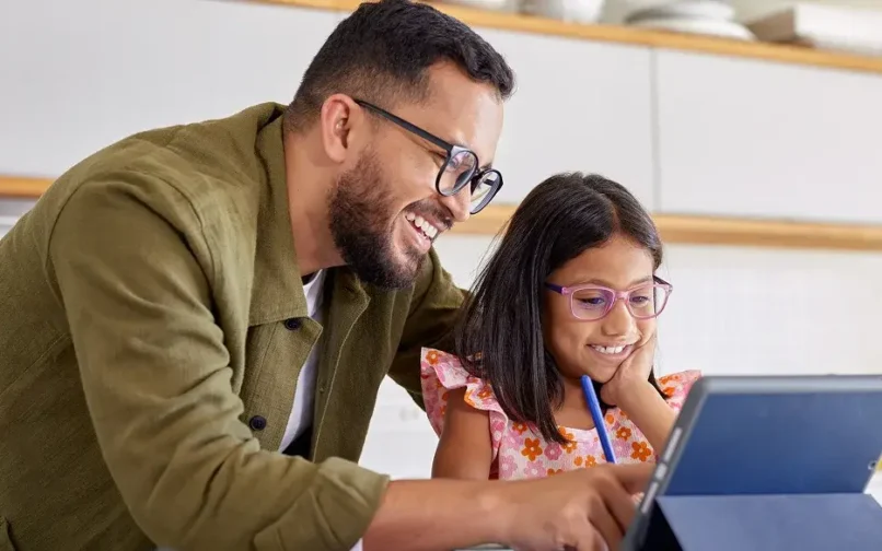 Father and daughter working with their ipad
