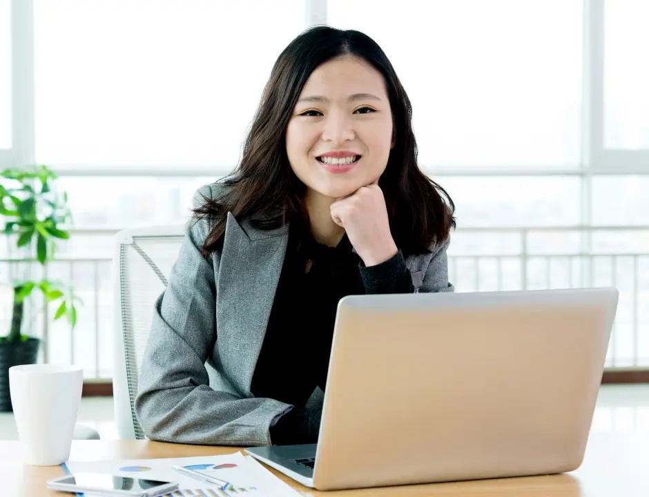 Girl smiling at computer