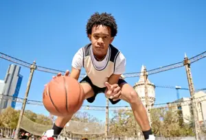 Student playing basketball