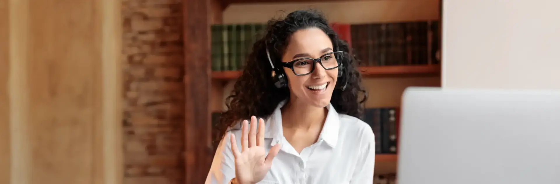 Counselor having a meeting wearing a black pair of headphones